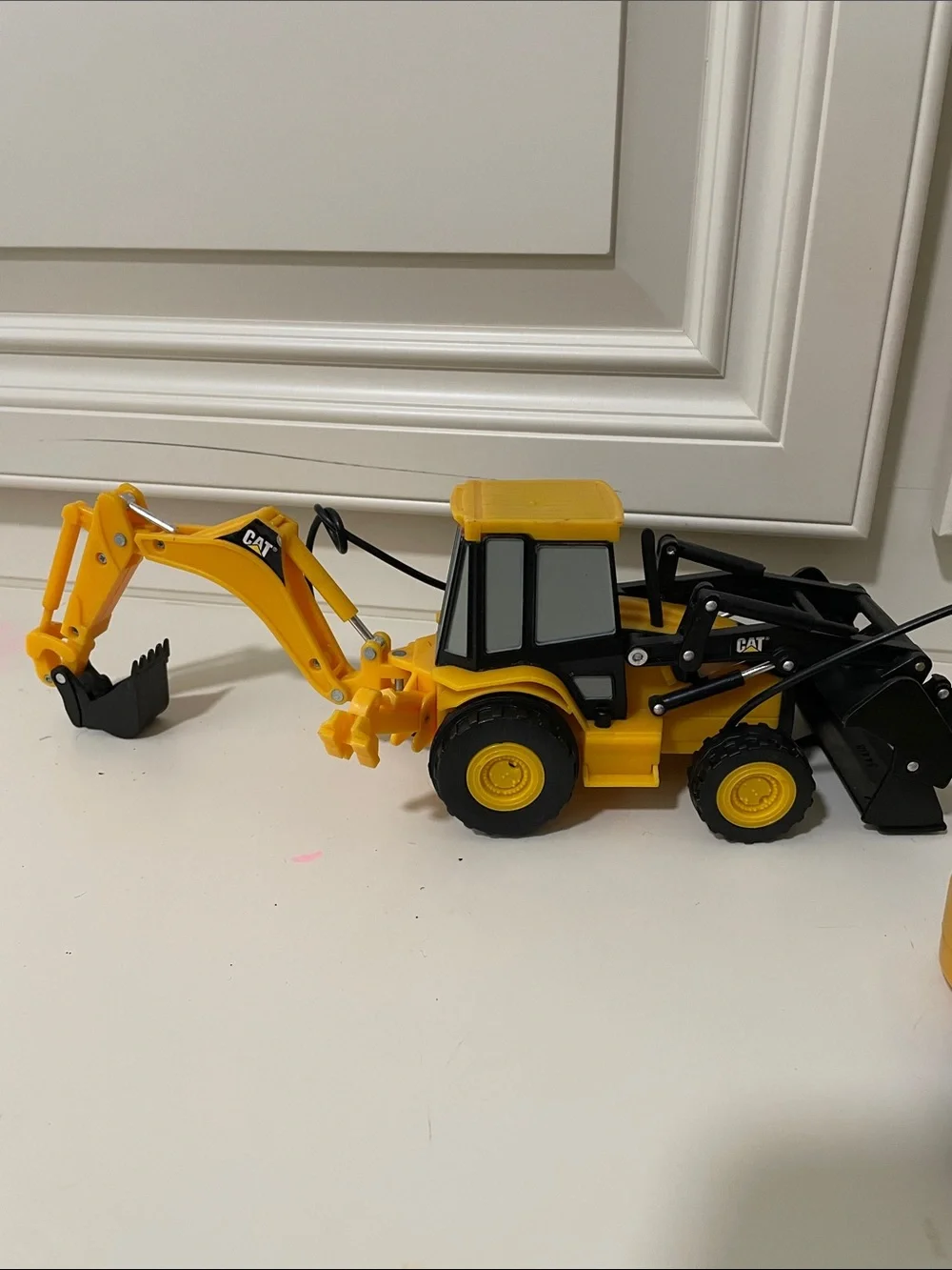 Yellow Remote-Control Backhoe Loader Toy not working works manually